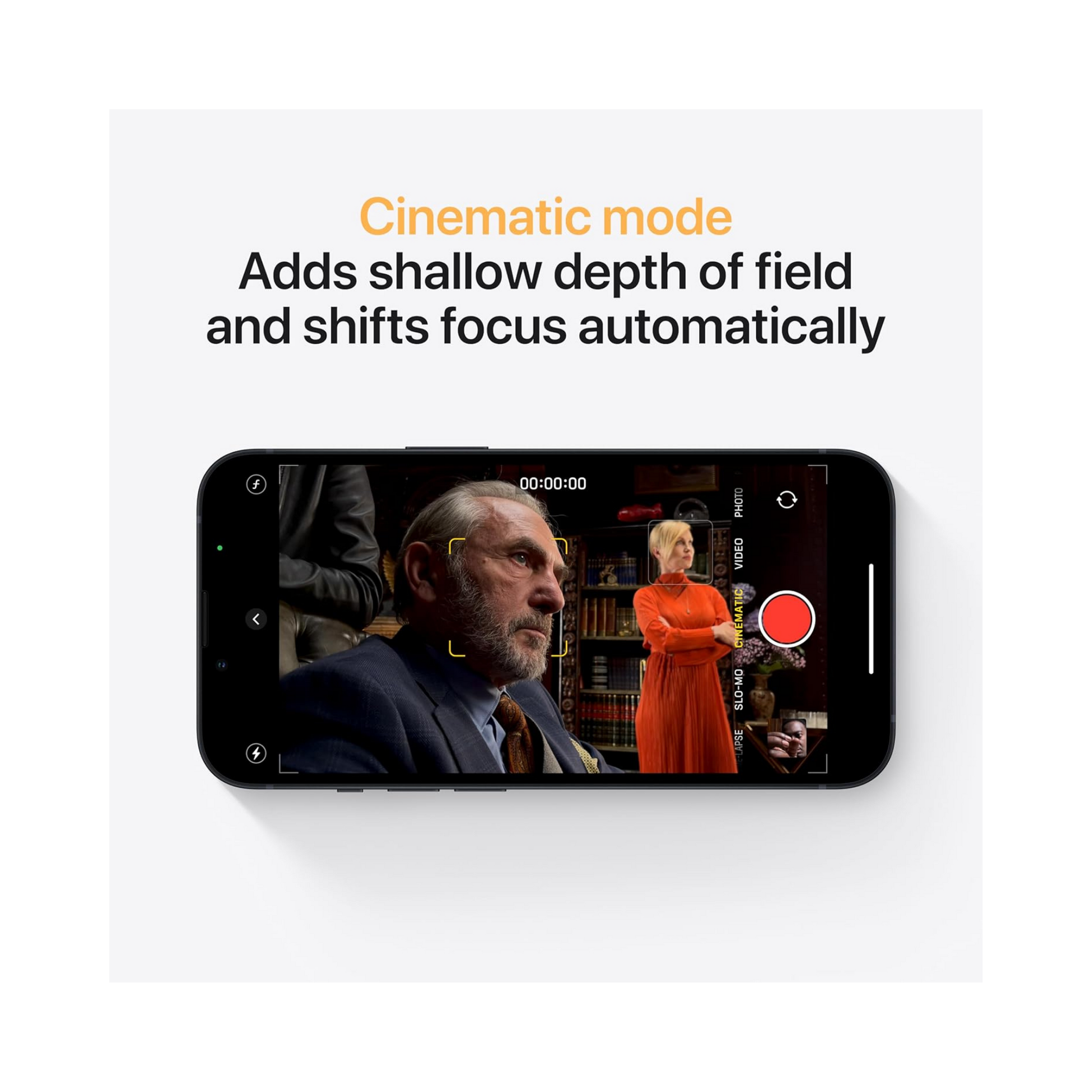 A smartphone shown on a light gray background with marketing text above it reading 'Cinematic mode' and 'Adds shallow depth of field and shifts focus automatically.' The phone screen displays a video recording interface with a red record button and a blurred indoor scene.